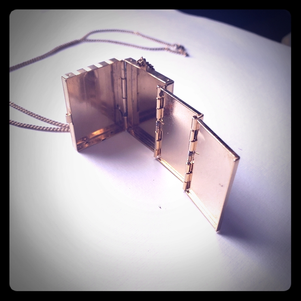 Gold fold out picture necklace